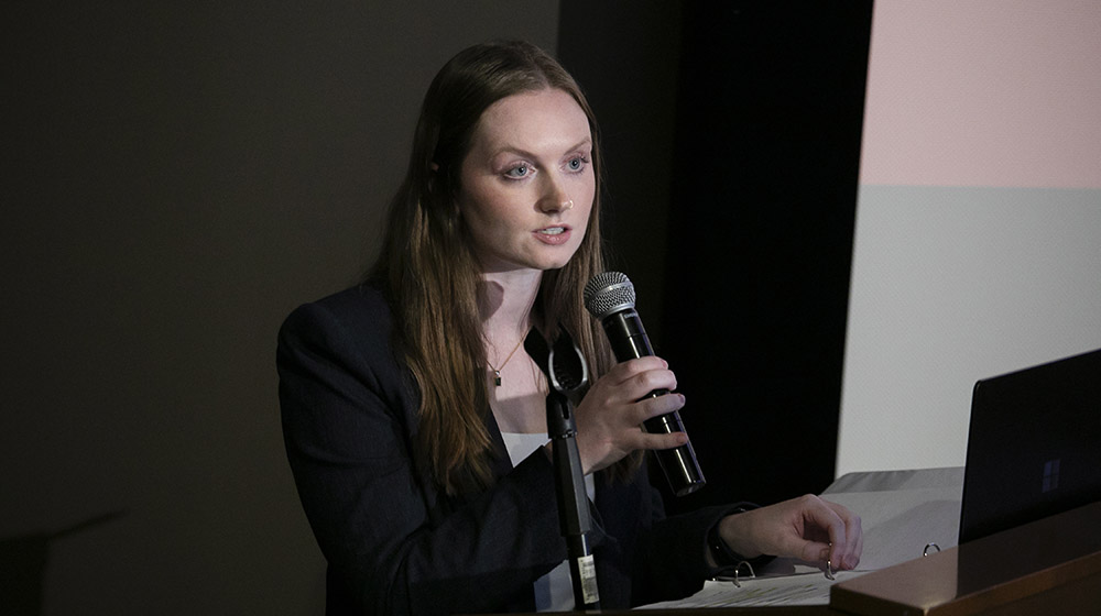 Emma Federico speaking into a microphone